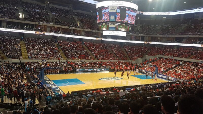 Crowd inside a packed basketball arena during a championship game