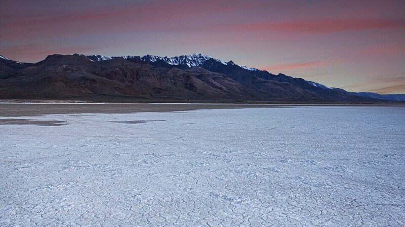Steens Mountain rising over the Alvord desert in Oregon at dusk
