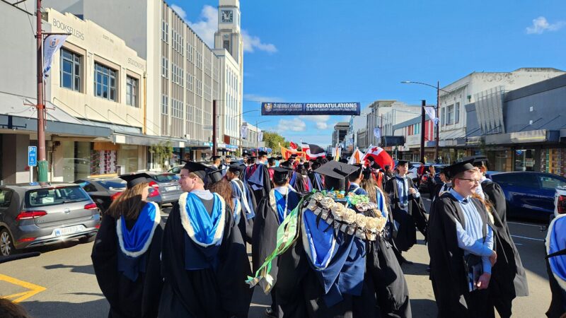 University graduates in academic dress at a graduation procession