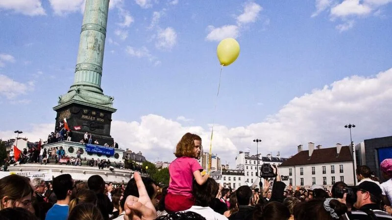 Crowd gathered at Place de la Bastille in Paris during a protest